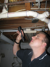 Home Inspector Checking Out Basement